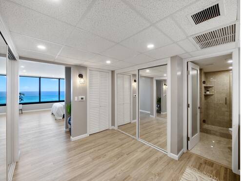 Bedroom with mirrored closets
