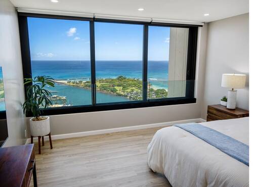 Bedroom with large window and marina view