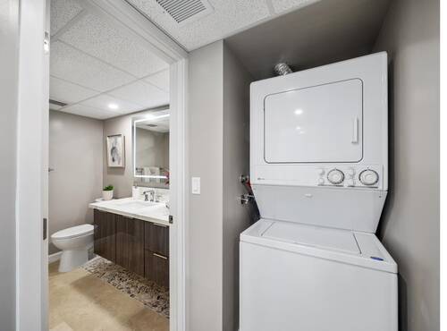 Bathroom vanity and stacked washer dryer