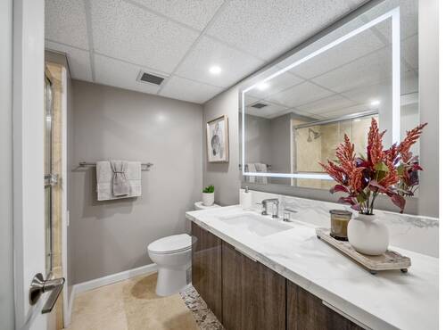 Bathroom vanity with lit mirror